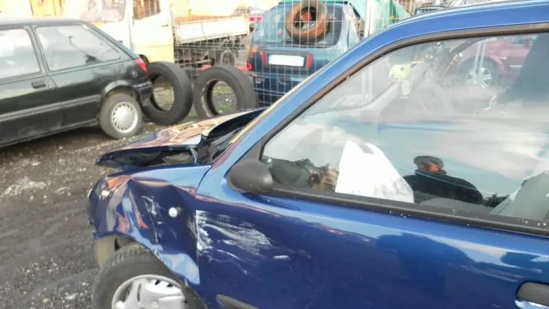 Sedan with side-impact collision damage — choosing a car accident lawyer in Stamford, CT