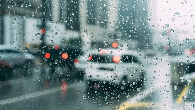 Traffic seen through a rain-covered windshield — choosing a car accident lawyer in Meriden, CT