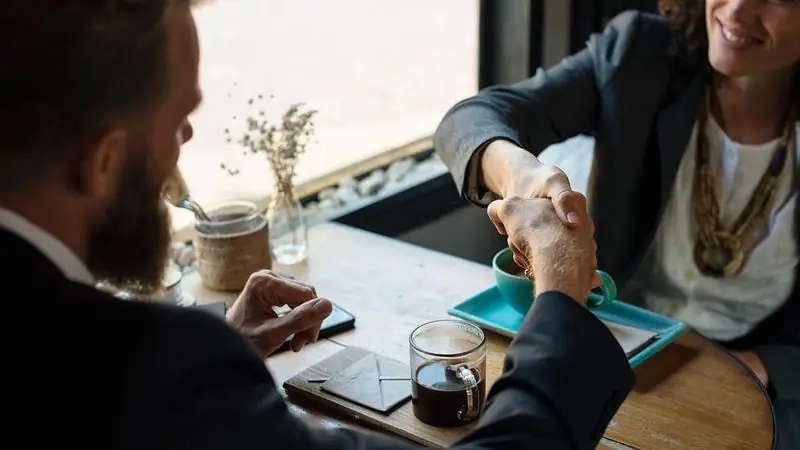 Handshake closing an agreement — car accident lawyer fees and costs in Meriden, CT